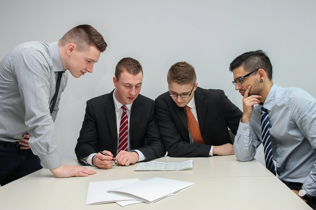 Royal Financial Group team reviewing a transaction